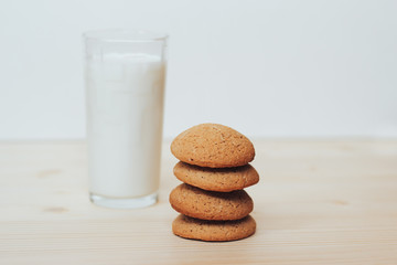 Cookies with a glass of milk on the table.