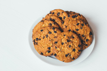 Chocolate cookies of on a plate on a white background