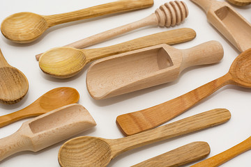 Set of wooden utensils, isolated on white background. View from above