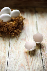White eggs inthe nest with shell