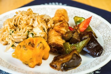 Vegetarian food - noodle with vegetable and spring roll.