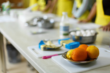 oranges and lemons in a metal plate in the kitchen. Confectionery baking courses. School of Cooking