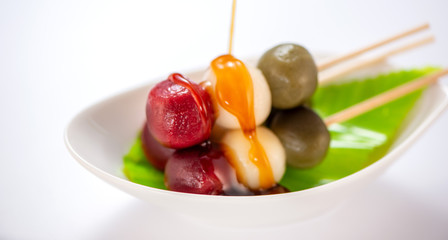 Japanese Dango dessert with 3 different color in pink(red), white, and green, recipe, hanami Dango, tsukimi Dango, copy space.
