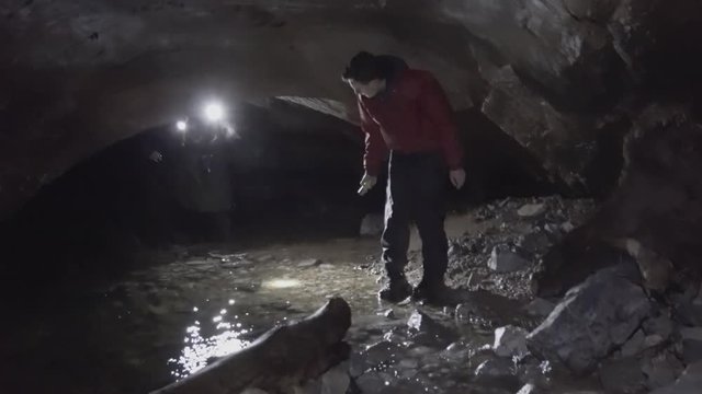 People exploring a cave