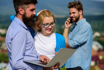 Business partners meeting non formal atmosphere. Colleagues with laptop work outdoor sunny day,...