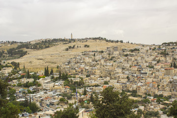 Obraz premium A view of the city of Jerusalem with in dense housing from the rooftop of the ancient Herod's Palace where Jesus Christ was ill treated.