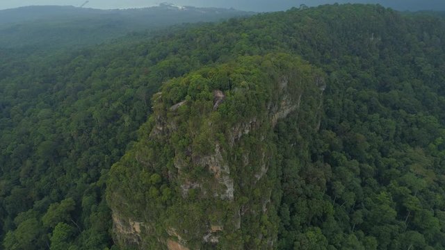 Tab kak hang nak hill mountain at krabi region. Big Mountain in the middel of the paradise standing out alone - aerial drone shot