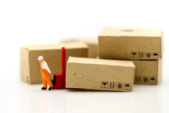 Miniature people: Worker and box with businessman shipping, rent container, business concept.