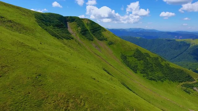 Aerial of a high mountain with steep slopes and flat top in the Carpathians