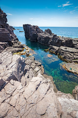 Rock formations on the cliffs of the island of San Pietro in Sardinia, Italy.