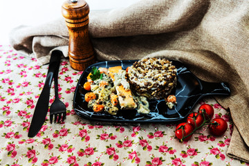 Baked salmon, vegetables and sorrel sauce accompanied oatmeal, lentil and cooked rice
