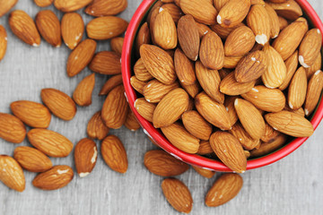 A ceramic bowl full of almonds