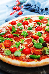 Sausage Pizza with Ham and tomatoes