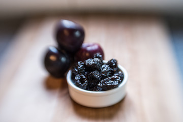 Prunes on foreground and plums on blurry background