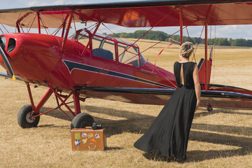 Red plane and a girl in the dress