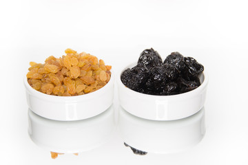 Raisins and prunes in isolated on white background