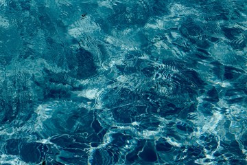 A close view of the waves in a swimming pool water.