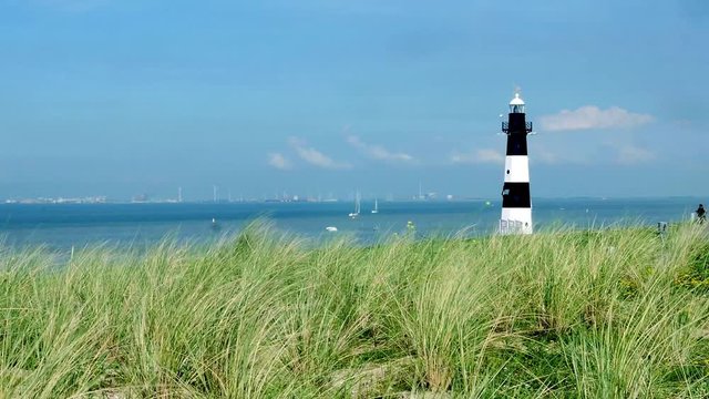 Breskens, lighthouse on a sunny and windy day