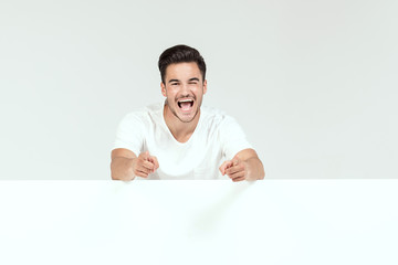 Handsome happy man with empty background.