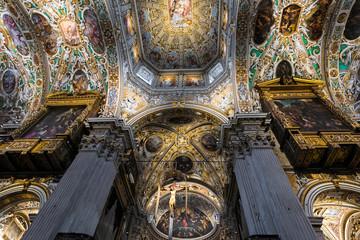Fototapeta na wymiar View of the interior of the Basilica of Santa Maria Maggiore in the upper town of Bergamo. Bergamo's most striking church, begun in 1137, is quite a mishmash of styles.