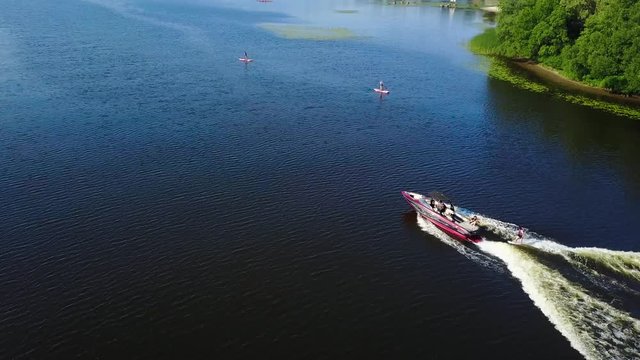 Motor boat pulls a wakeboarder