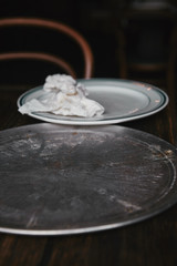 empty metal kitchen tray with white plate on table at restaurant