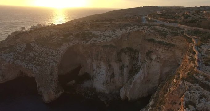 Aerial shot - Flying Sideways over Cliffs during Sunset