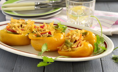 Yellow bell pepper stuffed with vegetables and noodles