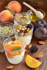 Healthy food - seeds, berries, yogurt, granola and fruit. Diet concept, vertical