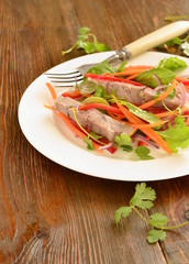 Salad with pork and vegetables, vertical