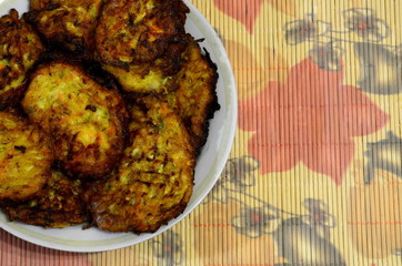 
Plate with vegetable fritters.
