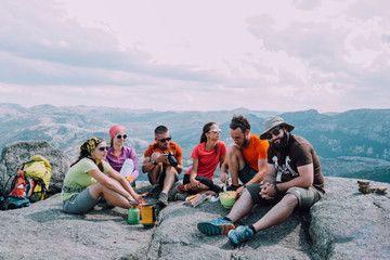 People friendship hangout traveling destination camping concept. Group of six hungry hikers...