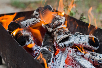 burning wood in a brazier, mangal or bbq