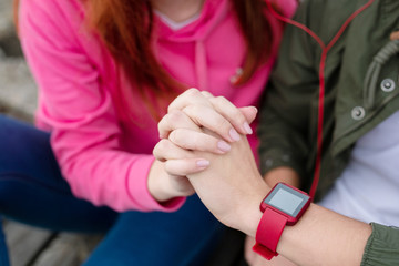 True love. Close up of hands of nice young couple being held together while showing their love