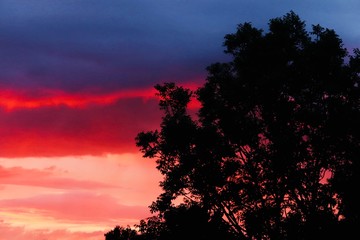 Deep,red and orange sunset over houses 