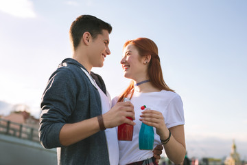 Romantic moments. Happy young couple smiling to each other while being in love