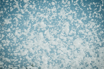 Soapy foam against the blue sky