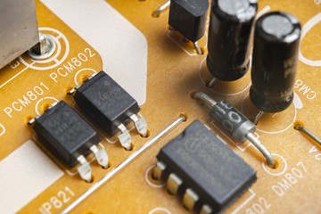 Macro shot of a Circuitboard with resistors microchips and electronic components. Computer hardware...