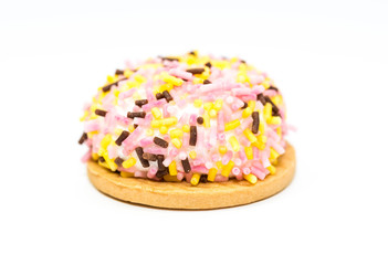 Delicious cup cake close up shot isolated on white background.