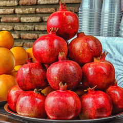 Fresh fruits of pomegranate and orange for making juice....