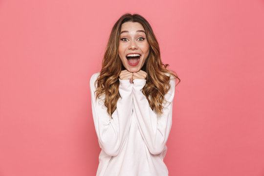 Portrait Of An Excited Young Casual Girl Screaming