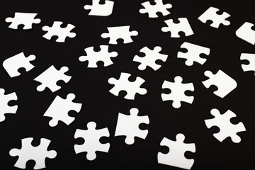 White jigsaw puzzle on black