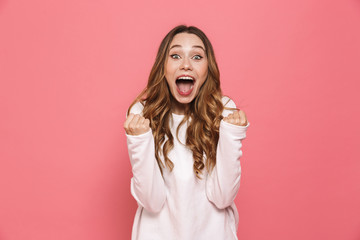 Portrait of a happy young casual girl screaming