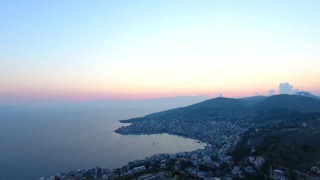Aerial view Lekuresi Castle in Sarande or Saranda, Albania, Europe. Sundusk coastline and city Saranda.
