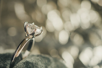 luxury engagement Diamond ring in jewelry gift box with bokeh light background