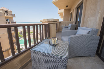 Terrace balcony with chairs in tropical luxury apartment