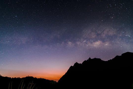 milky way galaxy over mountain in dawn