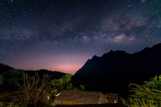 milky way galaxy over mountain in dawn