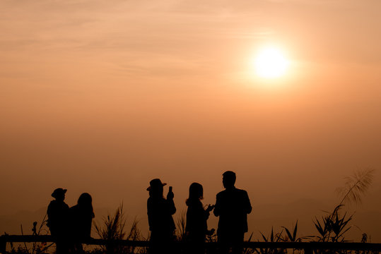 twilight sky and silhouette people