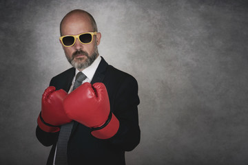 Businessman In red Boxing Gloves